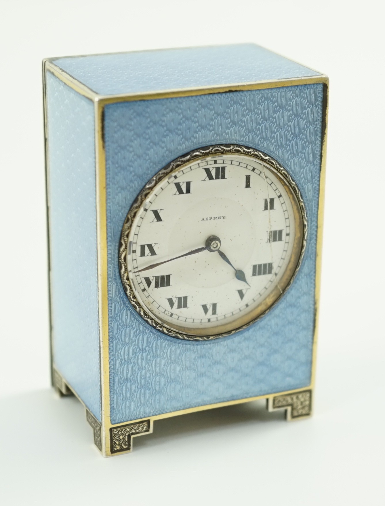 A George V continental silver and blue guilloche enamel miniature timepiece, retailed by Asprey